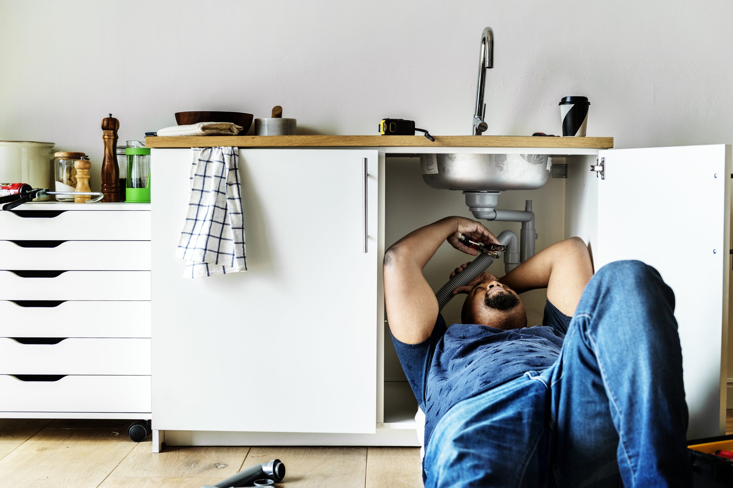 plumber-man-fixing-kitchen-sink